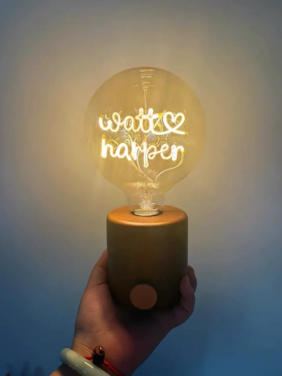 Personalized name LED filament bulb lamp glowing with couple names and heart on wooden base